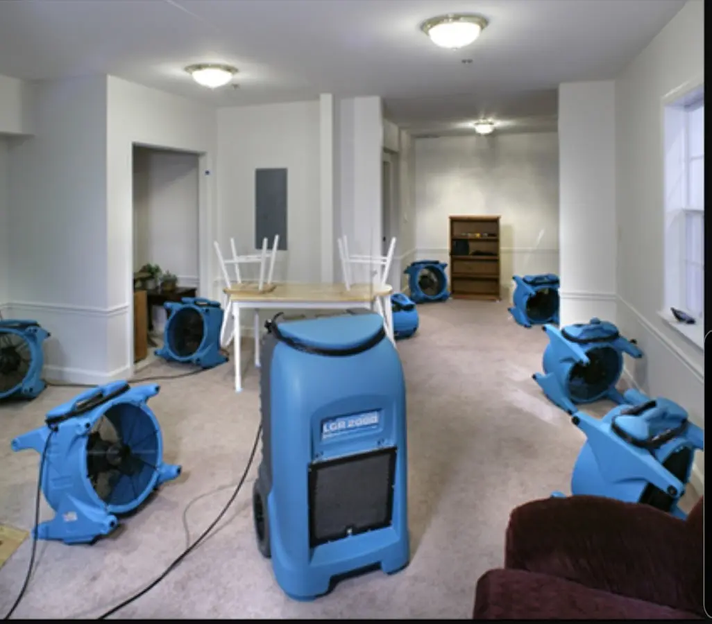 Air movers and dehumidifier setup for Water Damage Restoration in Emmett